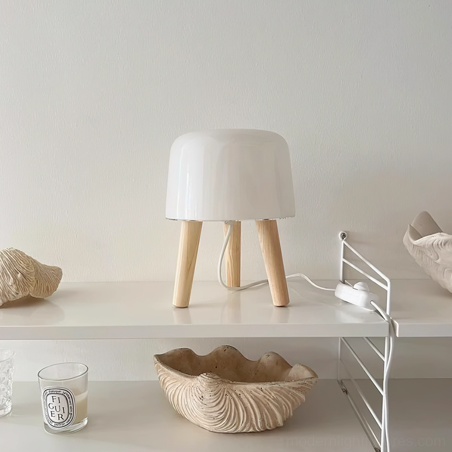 Overhead view of minimalist table lamp displayed on decorative home shelf with shell bowl and candle, Nordic design styling