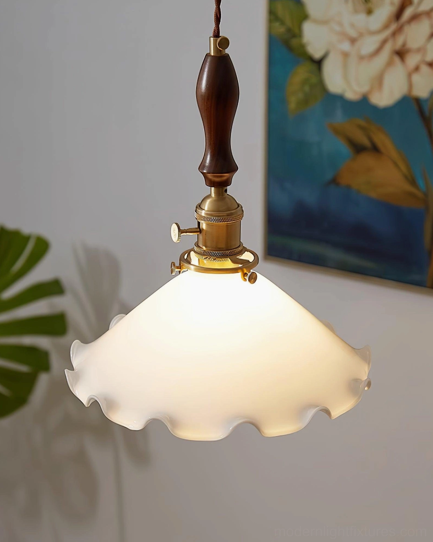 Milky flower pendant light with brass accents in eclectic interior design setting