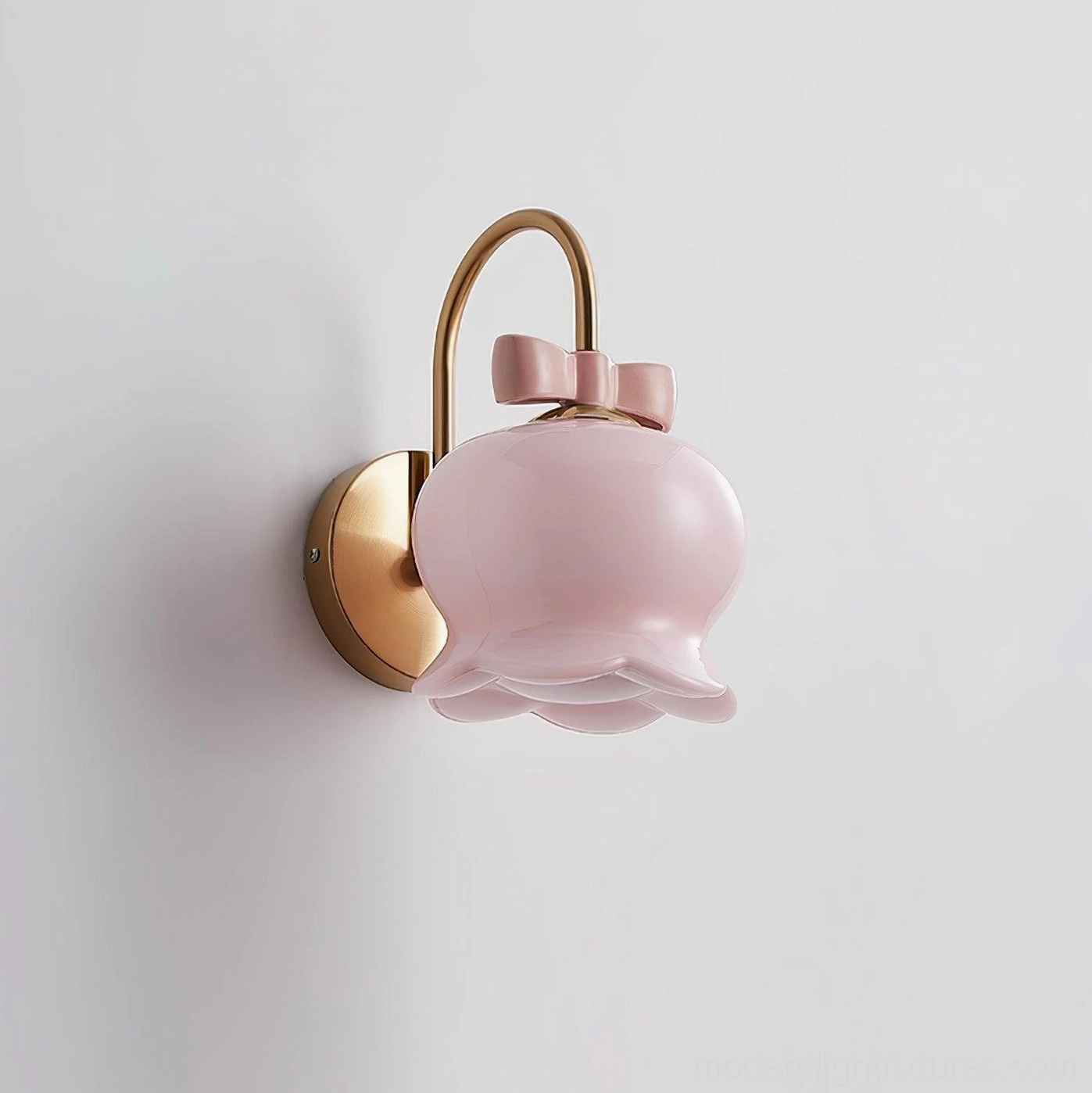 Millie Bells bell-shaped ceramic wall sconce with contemporary metal bracket and decorative bow, available in multiple finish colors