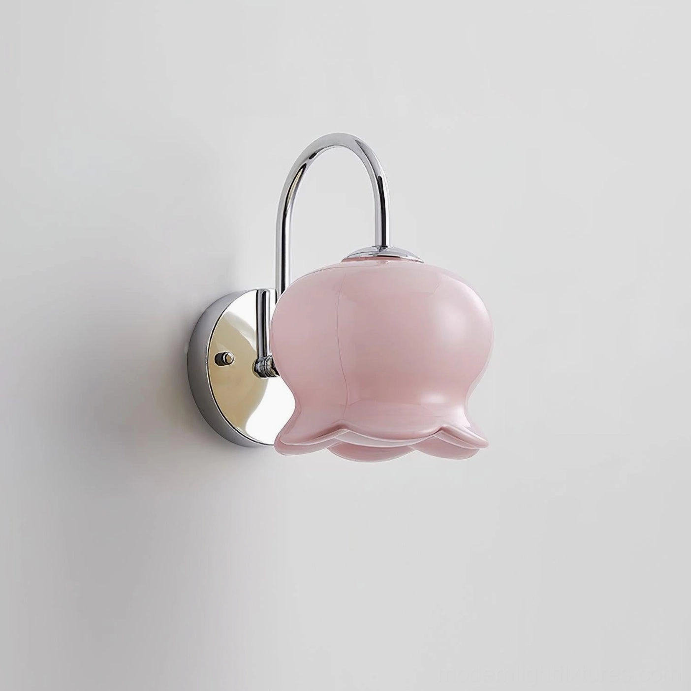 Sculptural Millie Bells ceramic wall sconce with bell silhouette and refined bow accent, contemporary minimalist lighting aesthetic