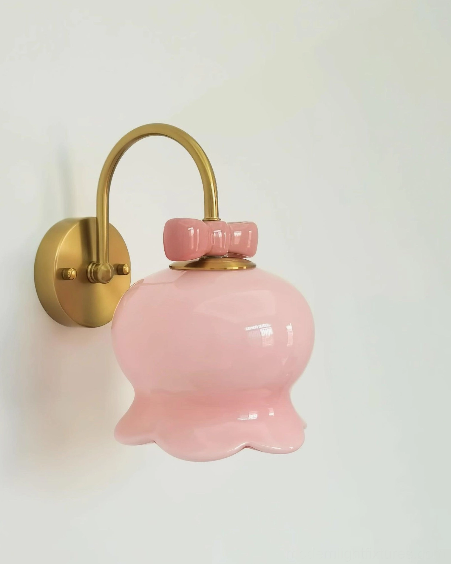 Complete Millie Bells wall sconce collection showing multiple color and finish variations with signature bow accent design
