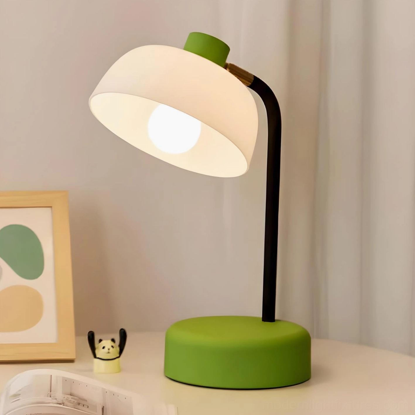 Modern arc table lamp with green base displayed on bedroom nightstand with Scandinavian interior styling