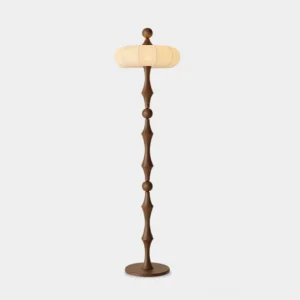 Milo mid-century modern floor lamp with walnut wood carved pole and off-white fabric lantern shade, front direct view against studio background