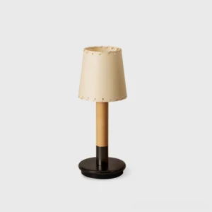 Minima cordless portable table lamp with tapered stitched fabric shade and premium wood base, front view on white background