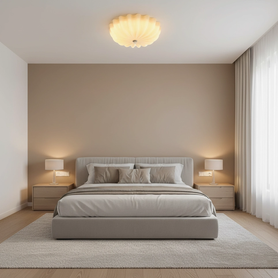 Minimalist primary bedroom with glowing jelly shell ceiling light providing warm ambient lighting