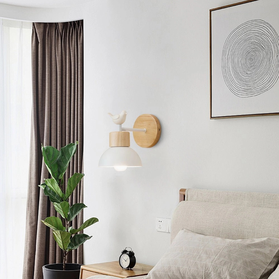 Minimalist bird wall sconce in bedroom setting with Nordic home decor, potted plant, and wall artwork