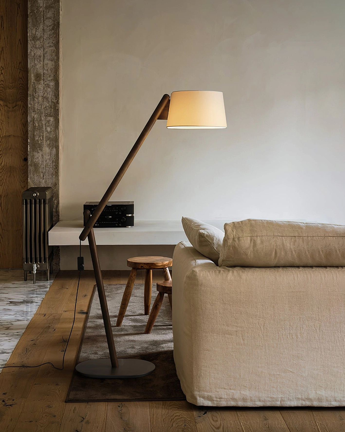Minimalist cantilever floor lamp featuring tall angular body and light-diffusing fabric shade design