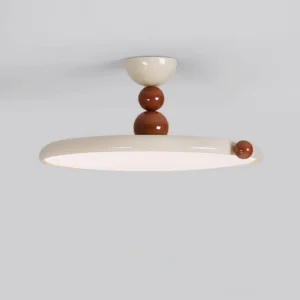 Side profile view of contemporary minimalist ceiling lamp showing stacked brown spherical hardware details and clean metal body