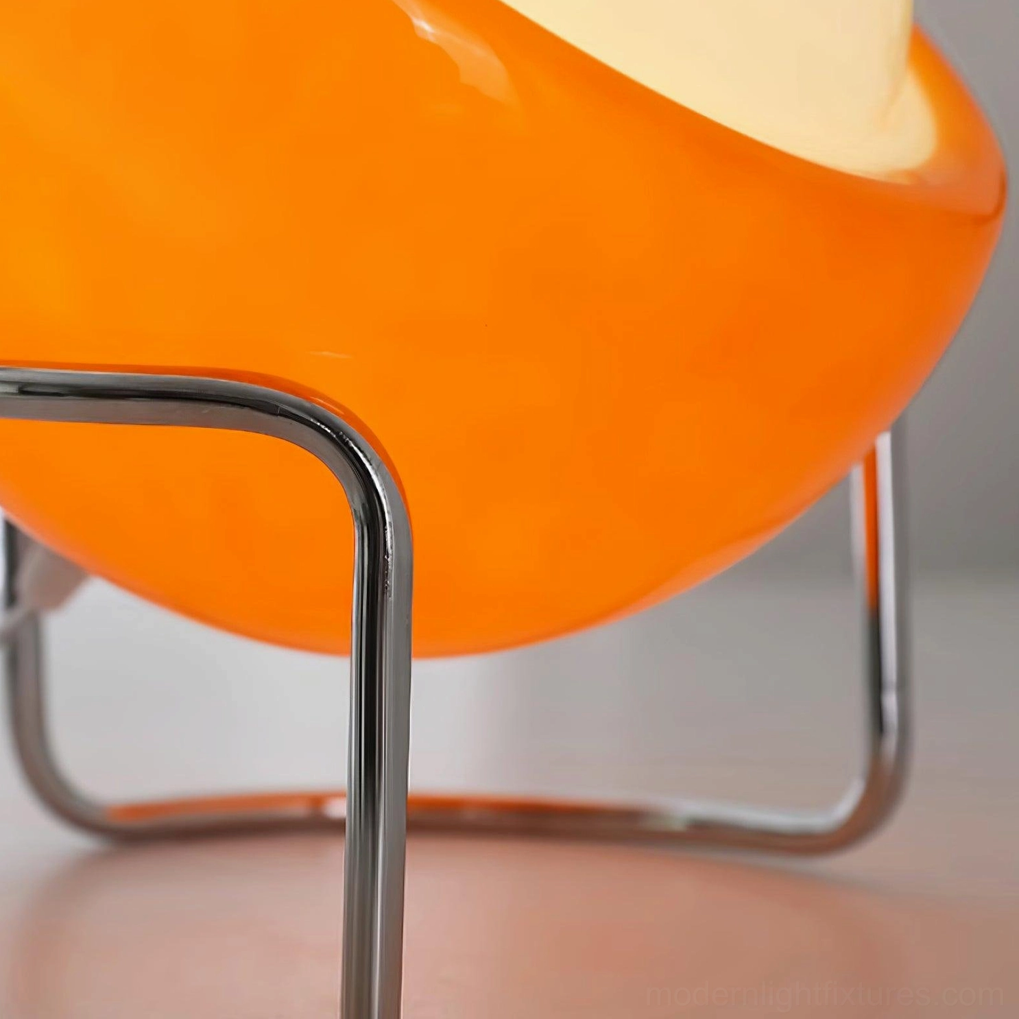 Minimalist dome table lamp with curved chrome stand, clean design for contemporary spaces