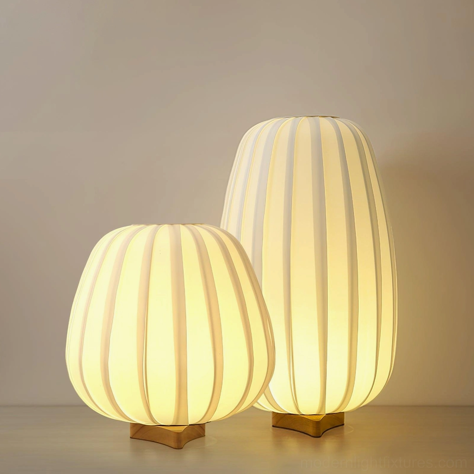 Minimalist fabric table lamp with vertical ribbed shade emitting soft warm ambient light