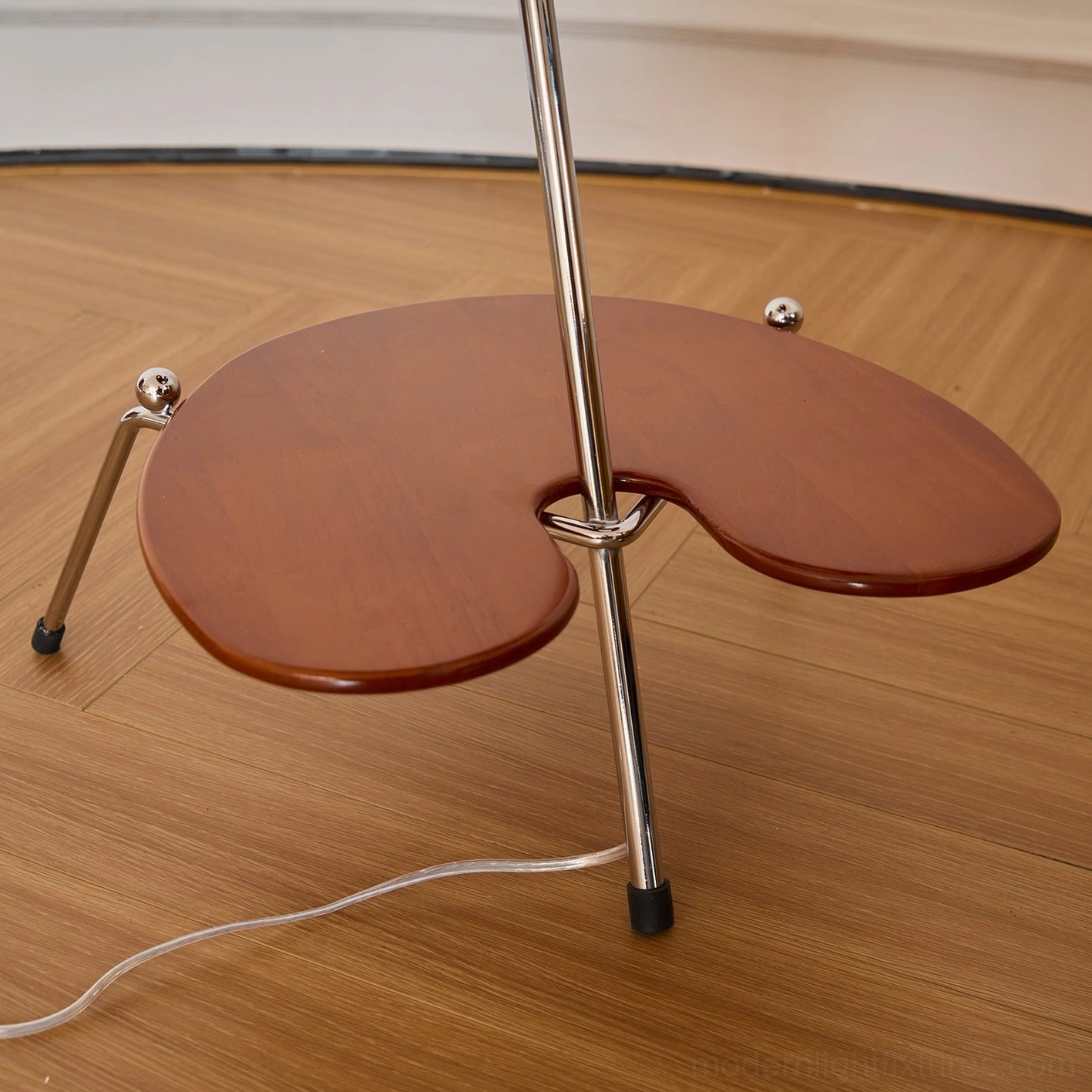 Minimalist architectural floor lamp with adjustable opal shade paired with modern furniture in bright bedroom