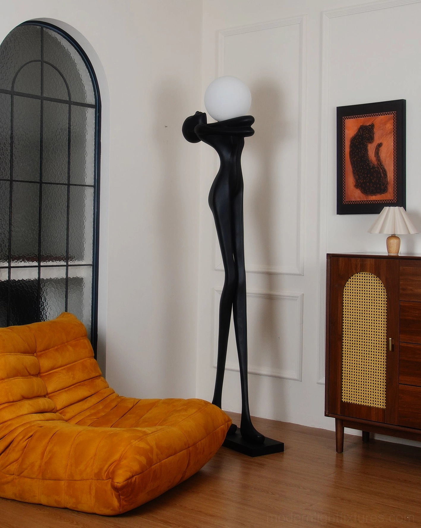 Minimalist floor lamp sculpture, contemporary black resin body, artistic home lighting fixture