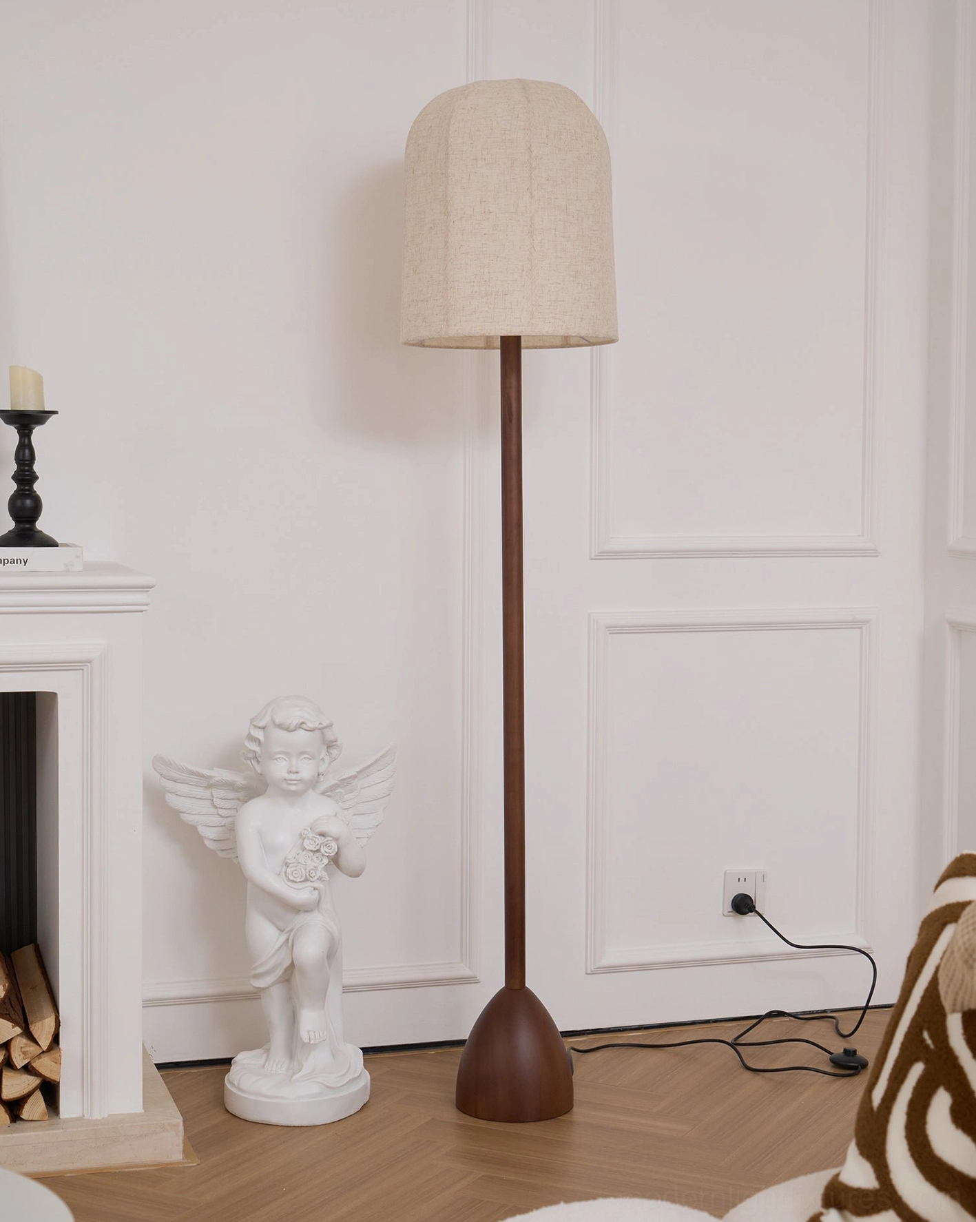 Minimalist floor lamp by fireplace - slim pole rounded tapered base brown and beige color scheme
