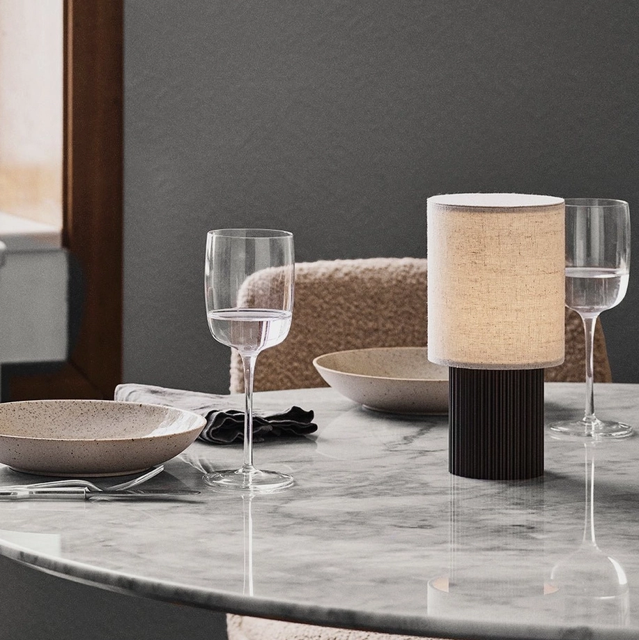 Modern minimalist table lamp with touch-activated control system and USB charging base, technical detail highlighting intelligent connected-living features