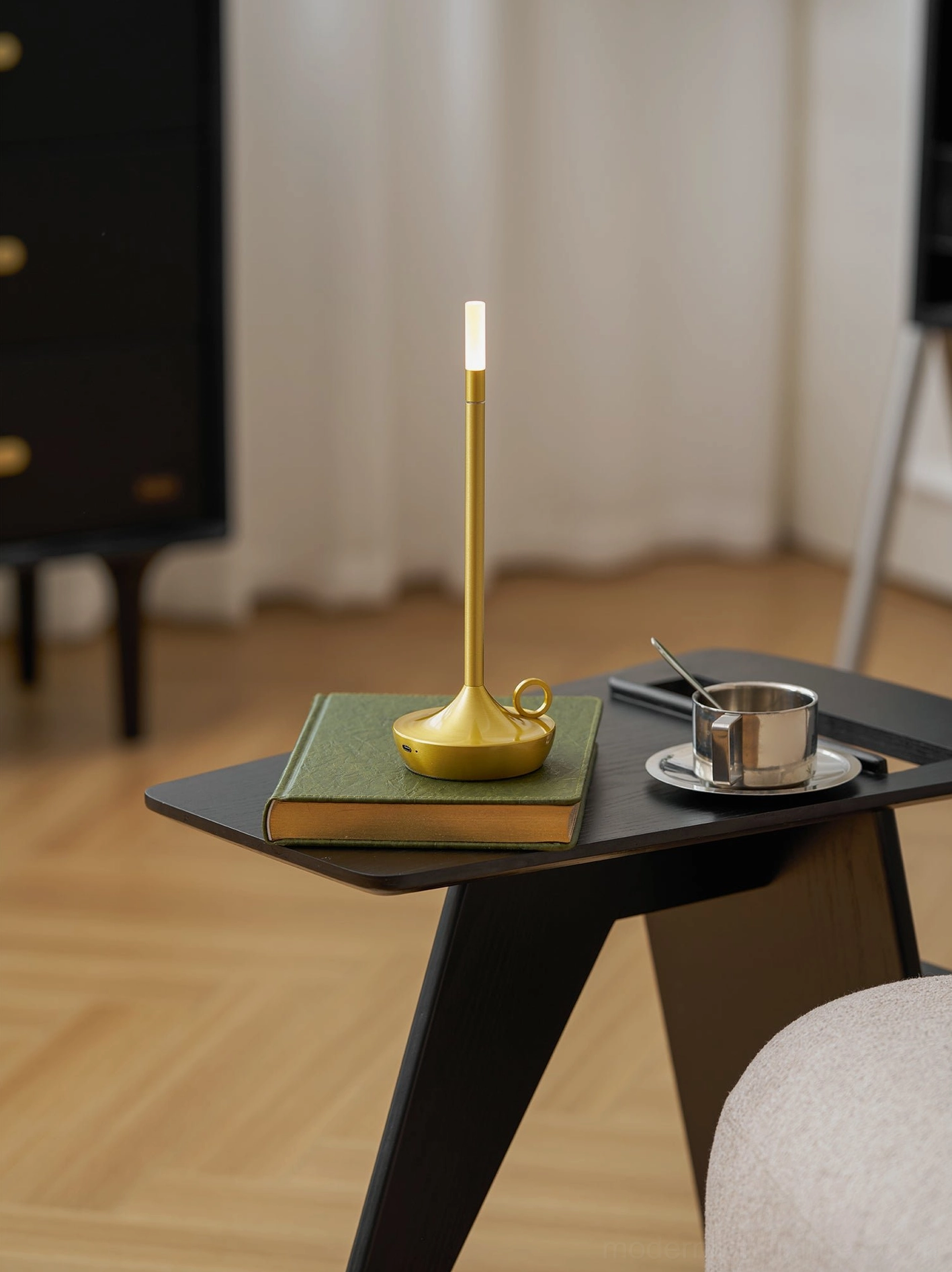 Minimalist metal table lamp on contemporary interior surface demonstrating Nordic Scandinavian design aesthetic