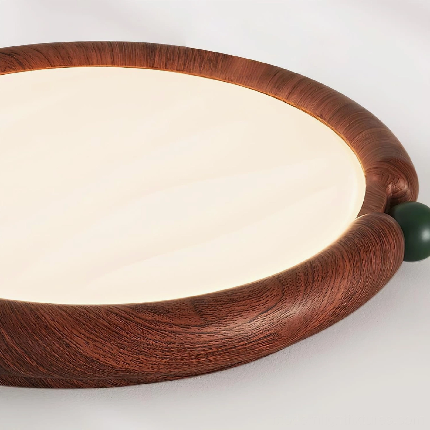 Modern round ceiling light mounted in minimalist bedroom with window blinds and earth-tone aesthetics