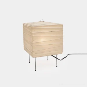 Modern minimalist paper cube table lamp with black metal frame in white, front three-quarter studio view