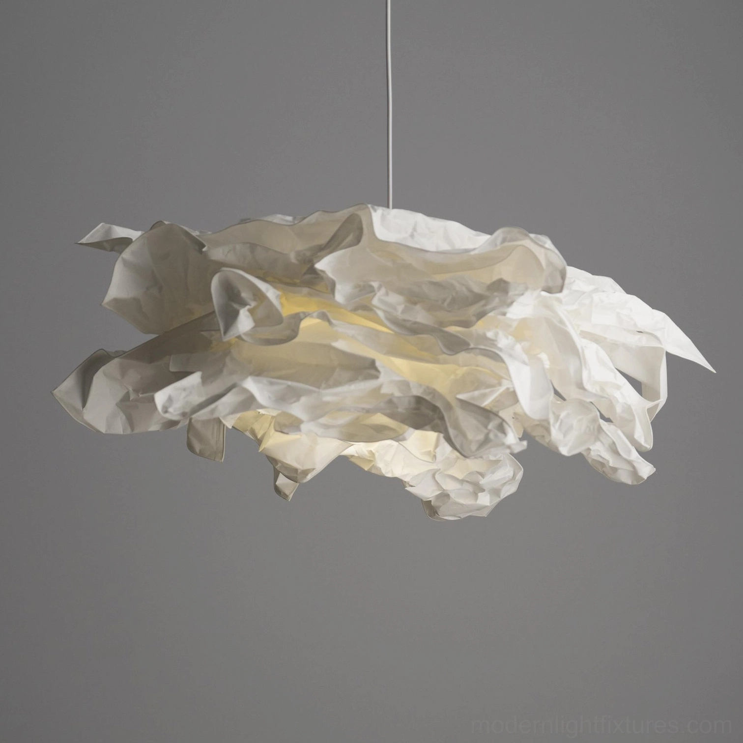 Modern minimalist paper pendant light with clean lines and organic sculptural form