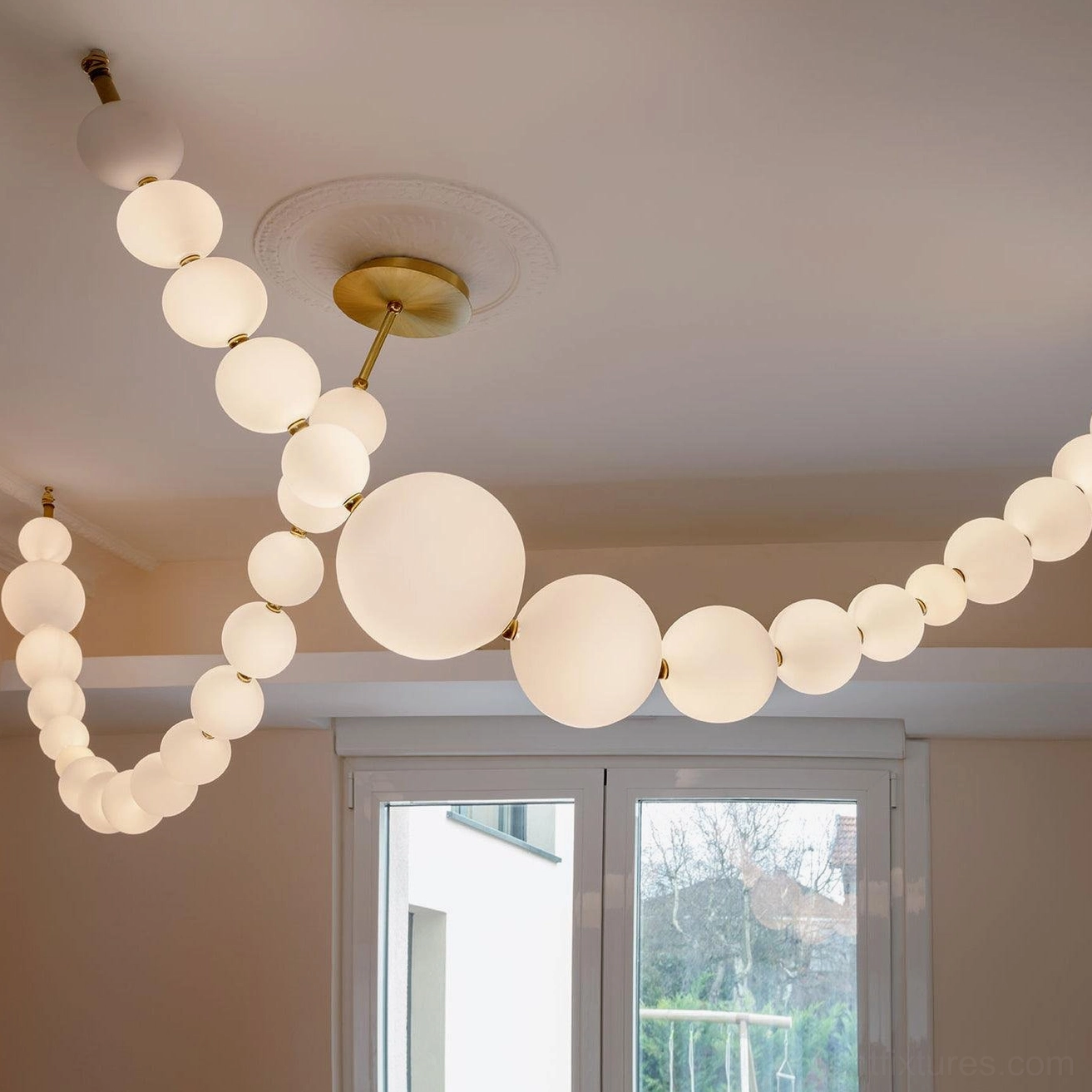 Modern minimalist pearl string pendant light with geometric acrylic sphere arrangement