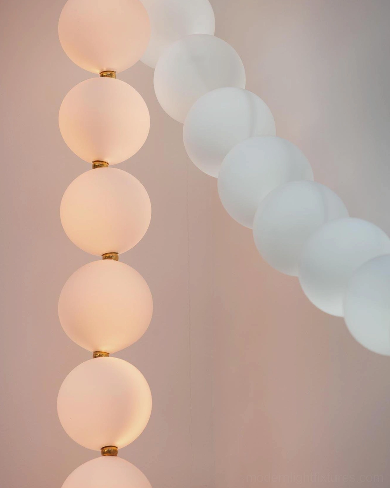 Modern minimalist pearl pendant light with geometric symmetry and contemporary design aesthetic