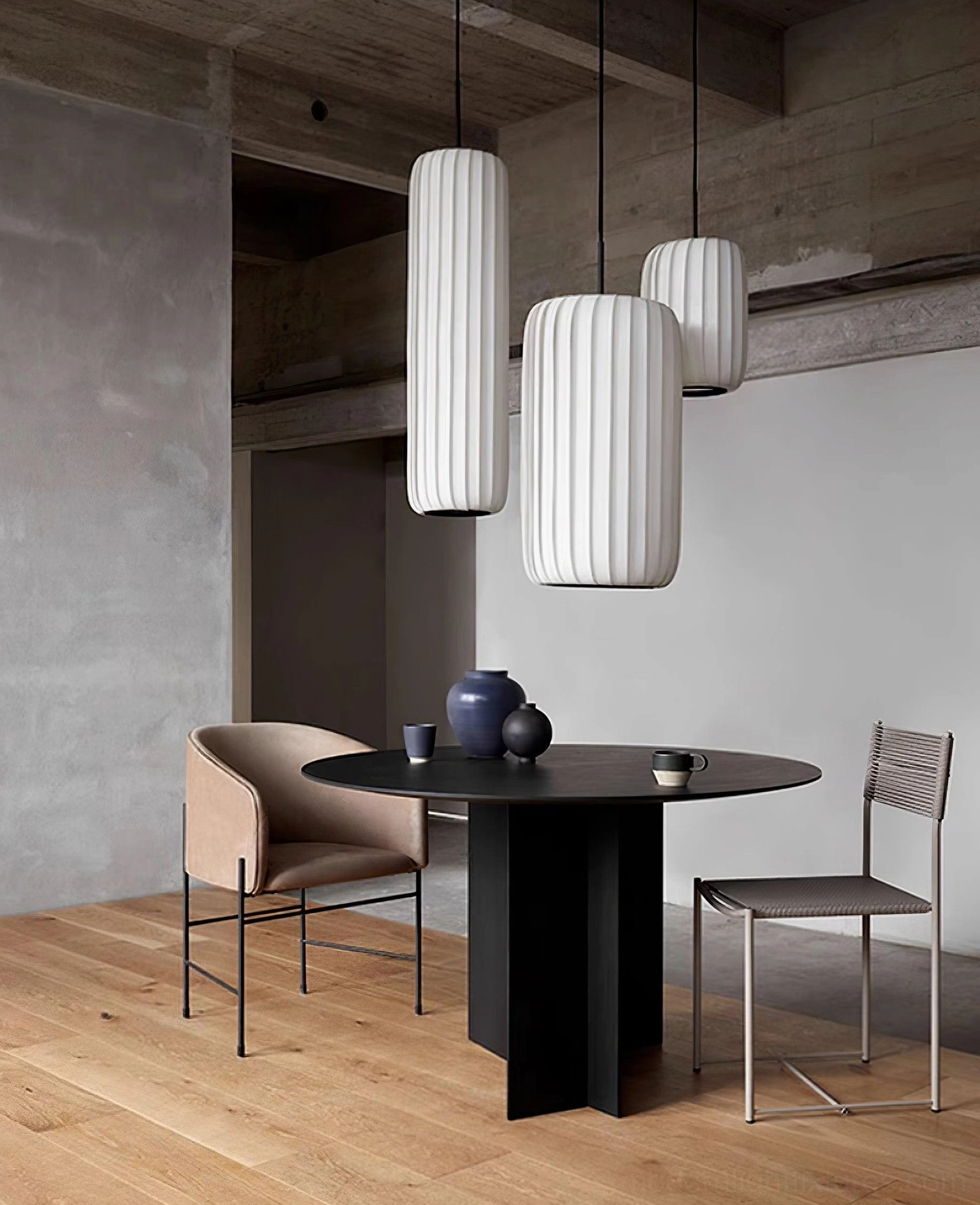 Side view of Rossau pendant lights in contemporary dining space with varied-sized shades