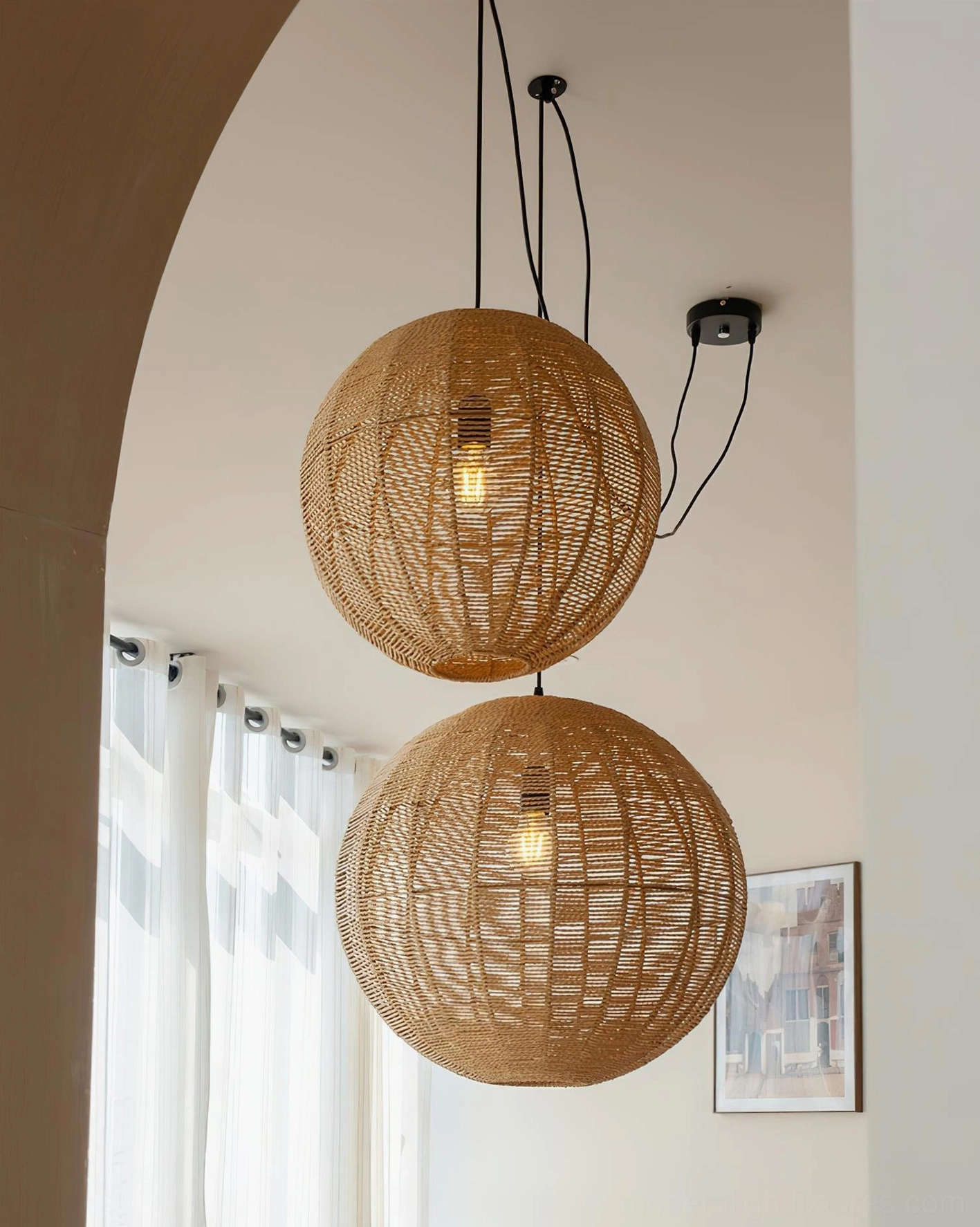 Rinwa natural rattan sphere pendant light with black hanging wire in minimalist setting
