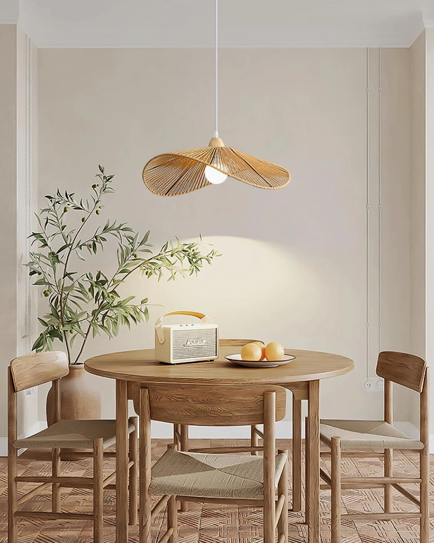 Light brown woven hemp rope pendant lamp in minimalist residential dining room setting