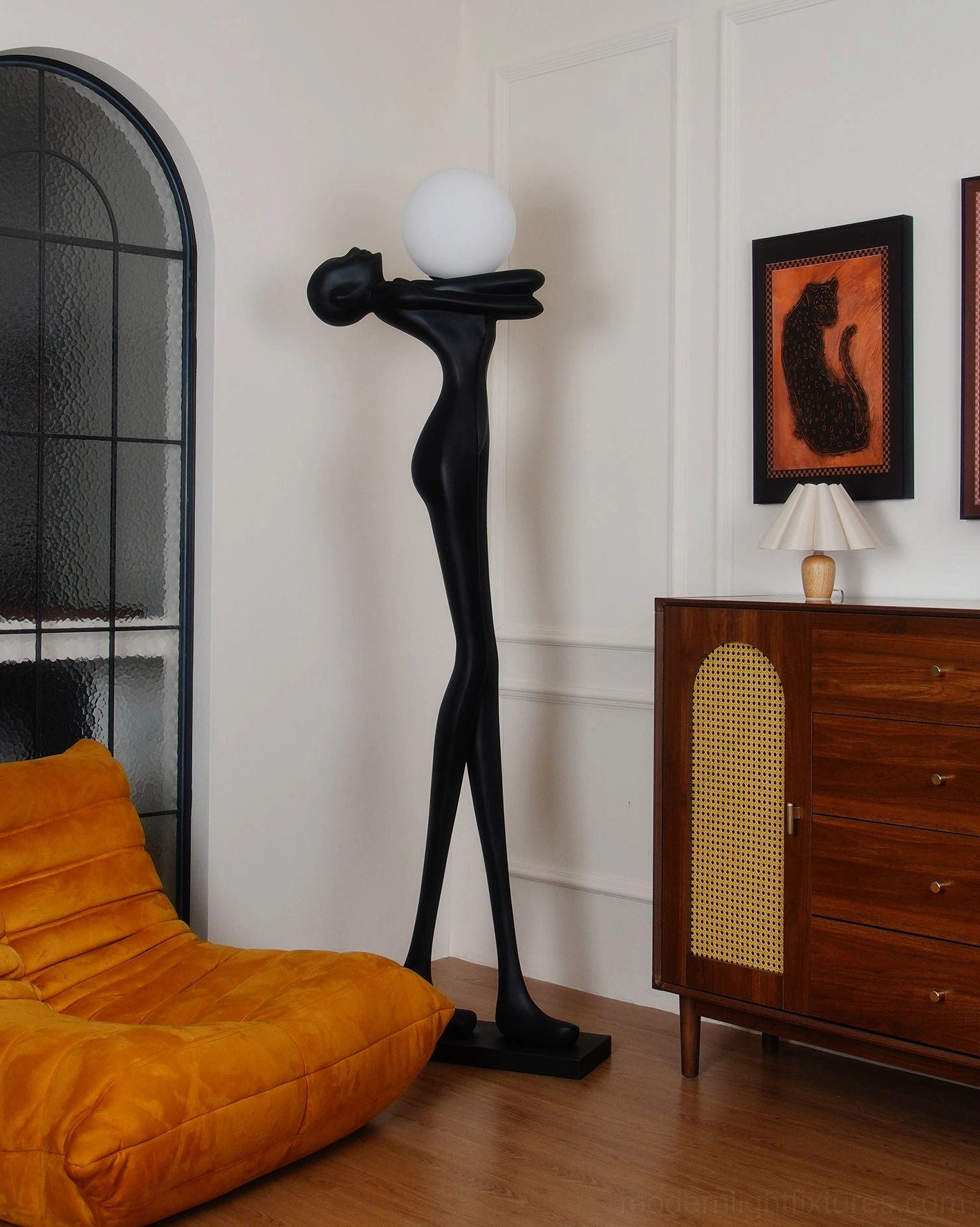 Modern minimalist floor lamp, black resin sculptural body, artistic statement piece for contemporary homes