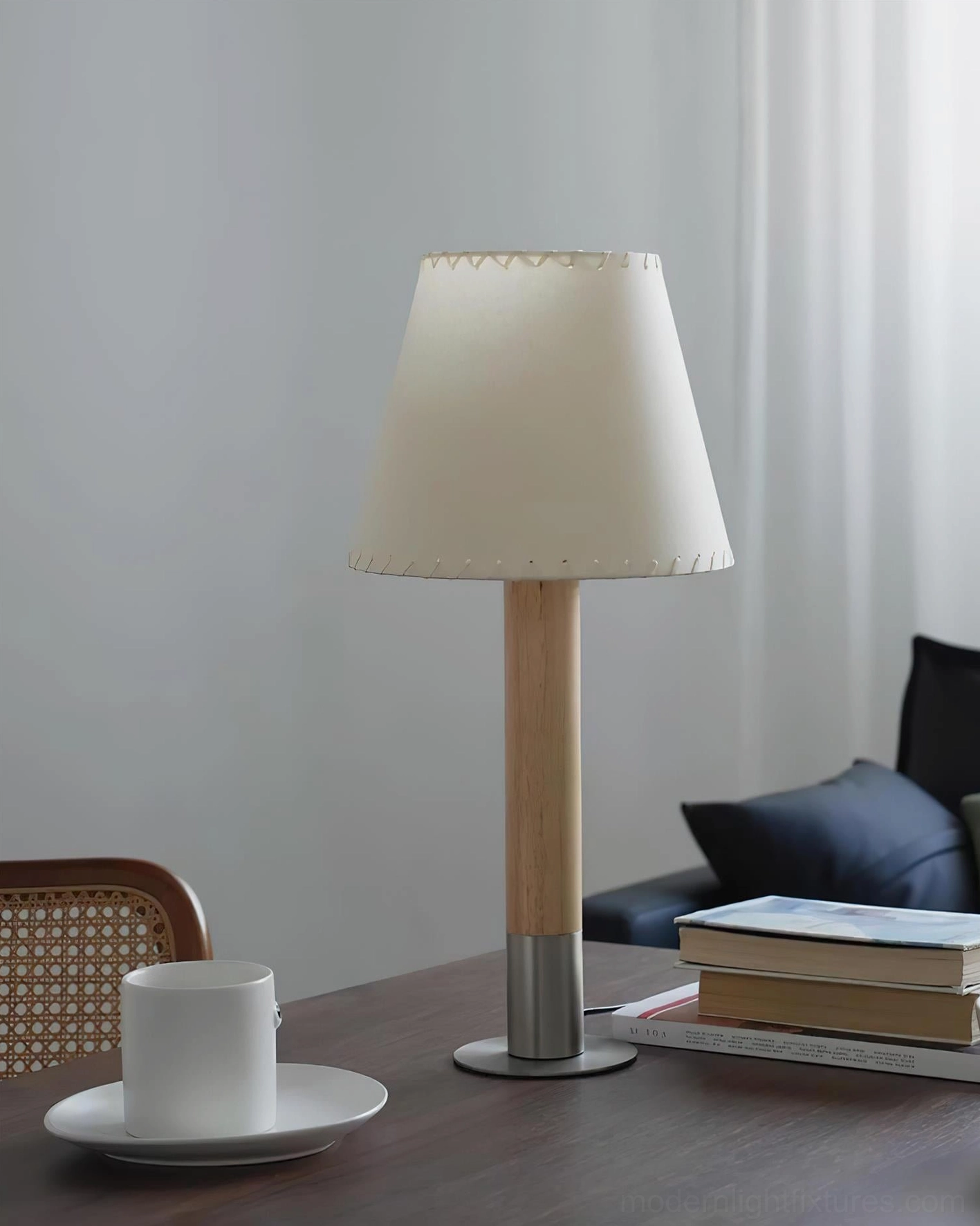 Minimalist table lamp on bedroom nightstand creating soft ambient lighting in modern bedroom