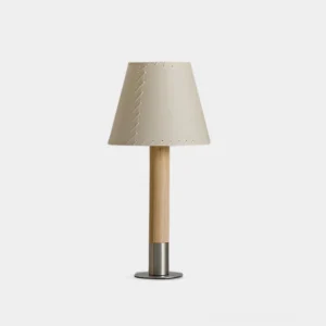 Minimalist handcrafted table lamp with stitched fabric shade, natural wood stem, and metal base - front view