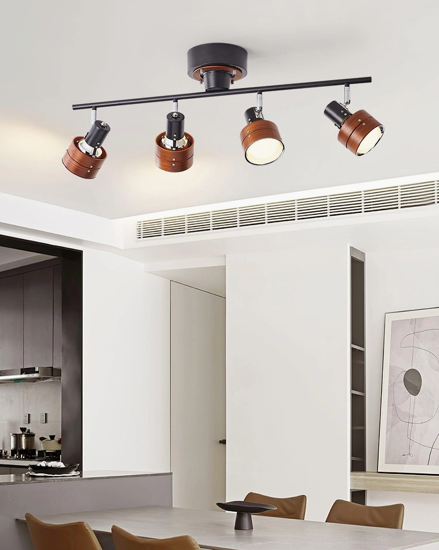 Track spotlight system with mixed wood and metal finishes shown in minimalist room setting