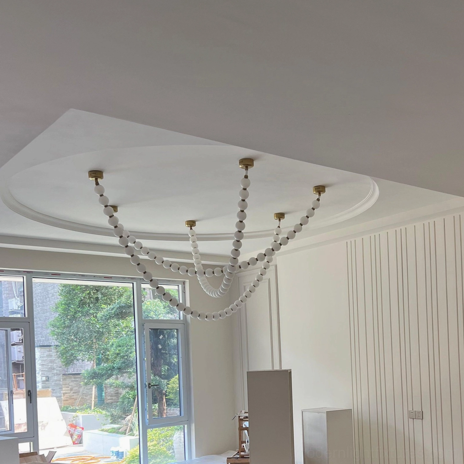 Modern minimalist U-shaped thin pearl string chandelier with small frosted beads and delicate metal framework