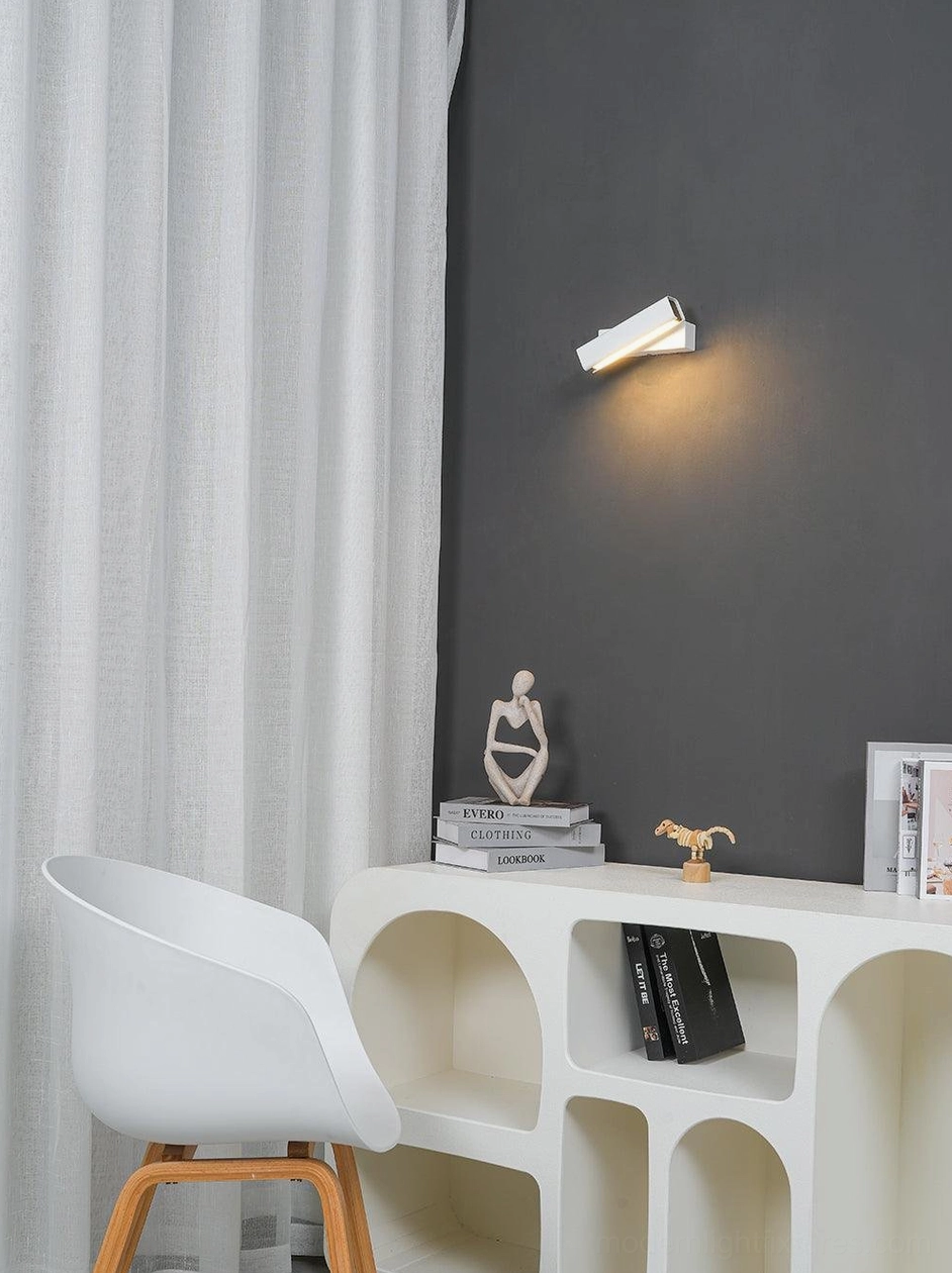 Minimalist Nordic wall sconce installed in contemporary bedroom setting with clean modern decor