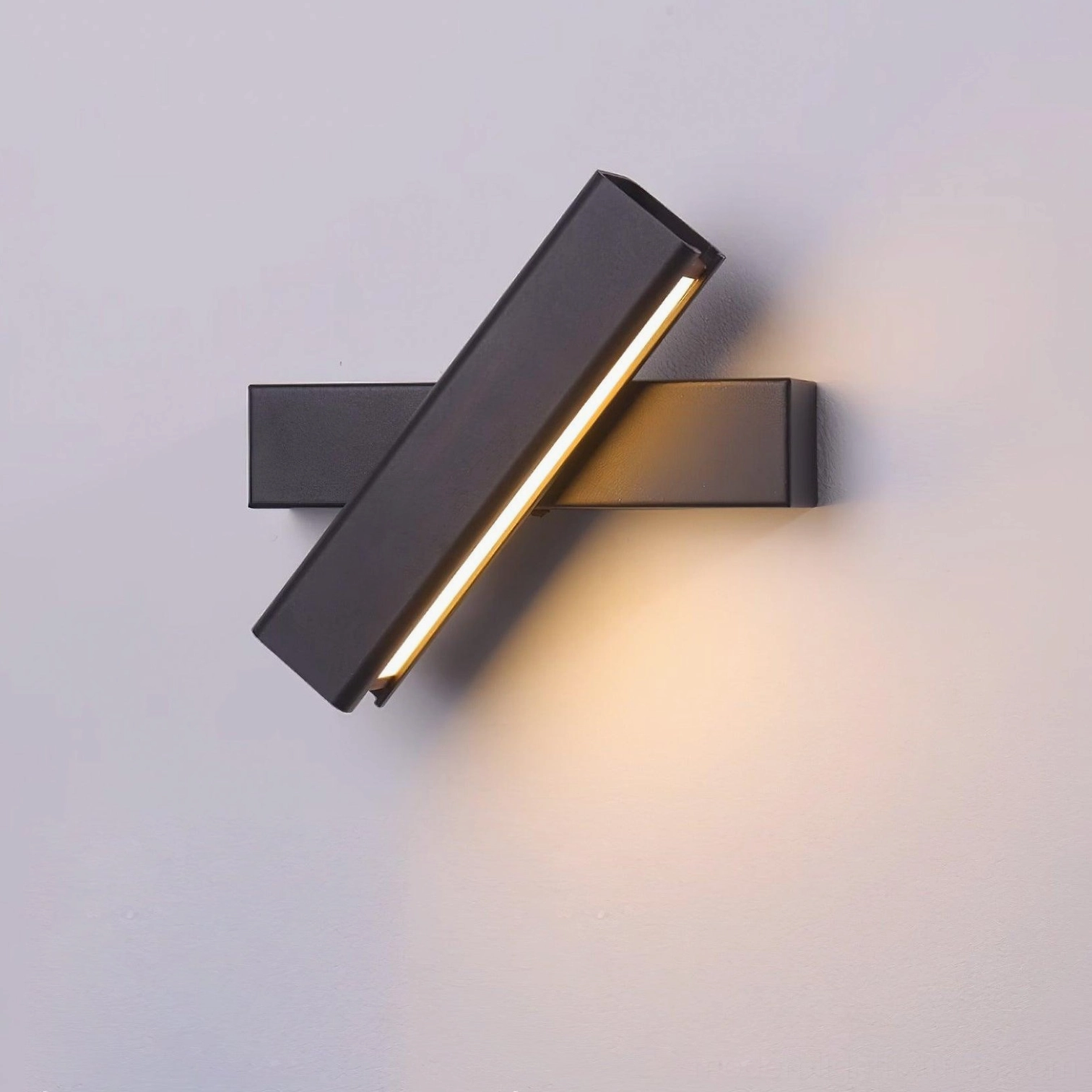 Minimalist wall lamp with integrated LED technology installed in contemporary home office