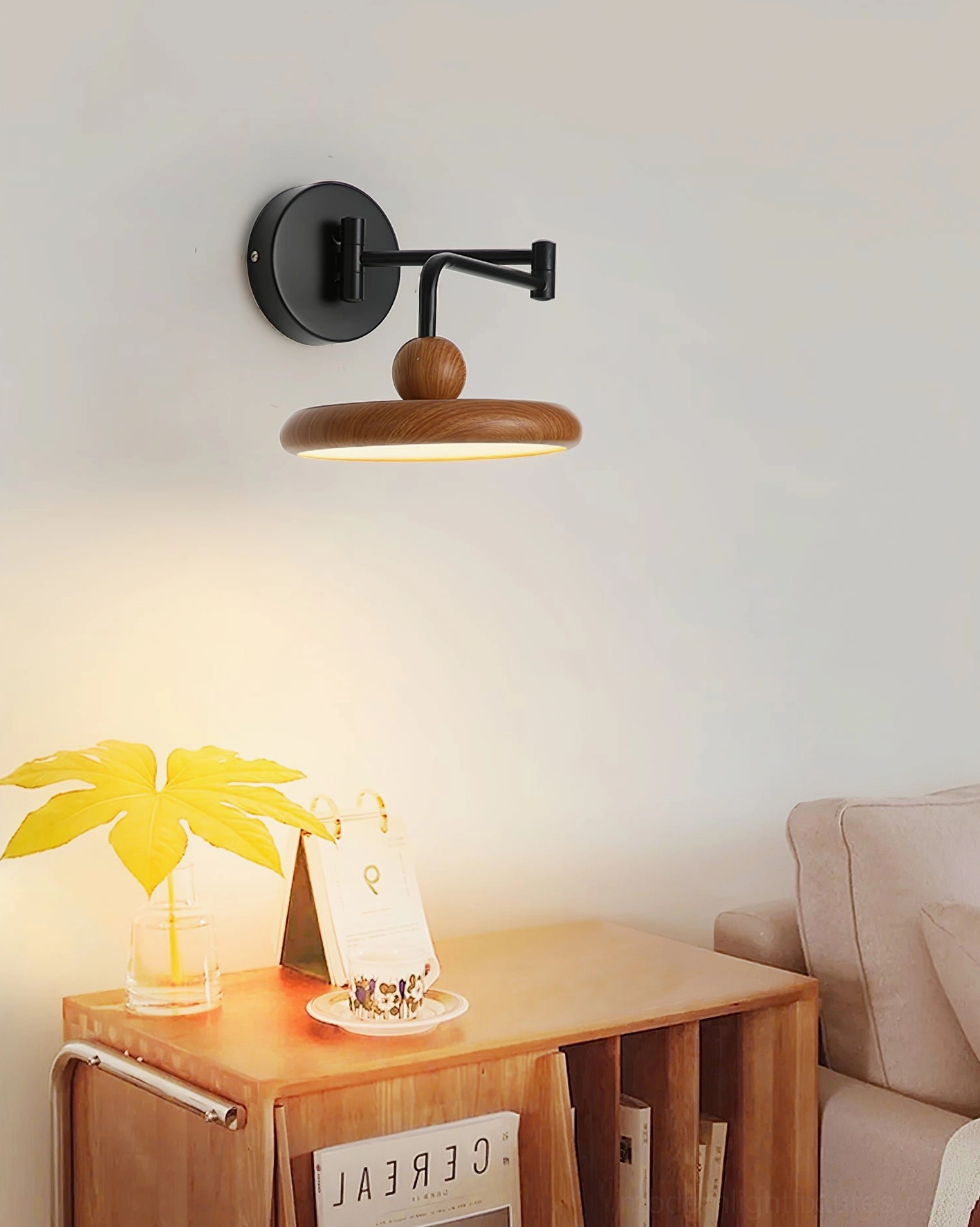 Modern adjustable wall lamp in minimalist living room corner providing directional task lighting