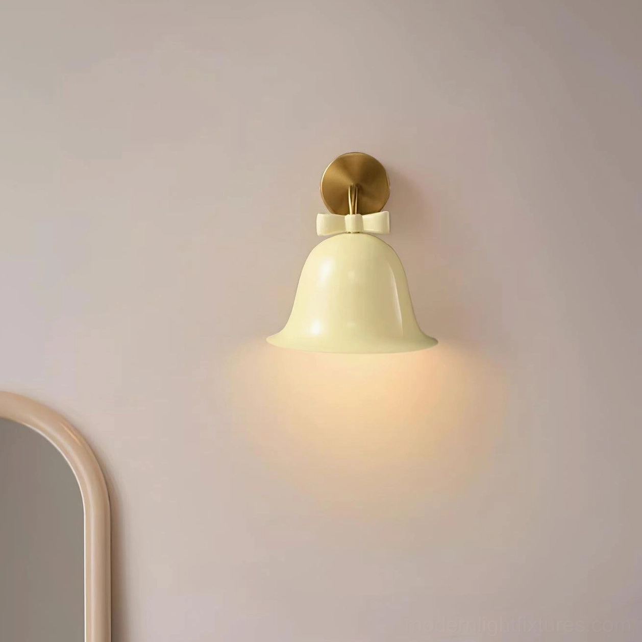 Simple minimalist white bell-shaped wall lamp with brass base mounted on interior wall