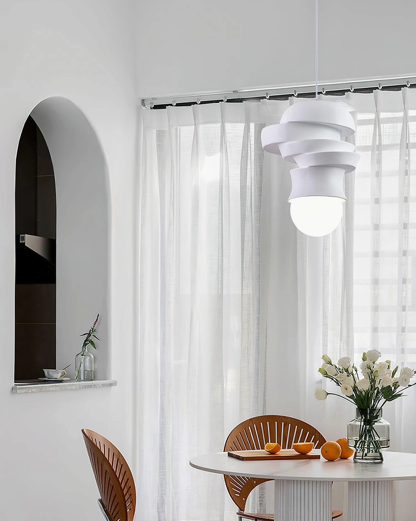 Minimalist modern pendant light with white matte finish and layered shade design, contemporary home lighting solution