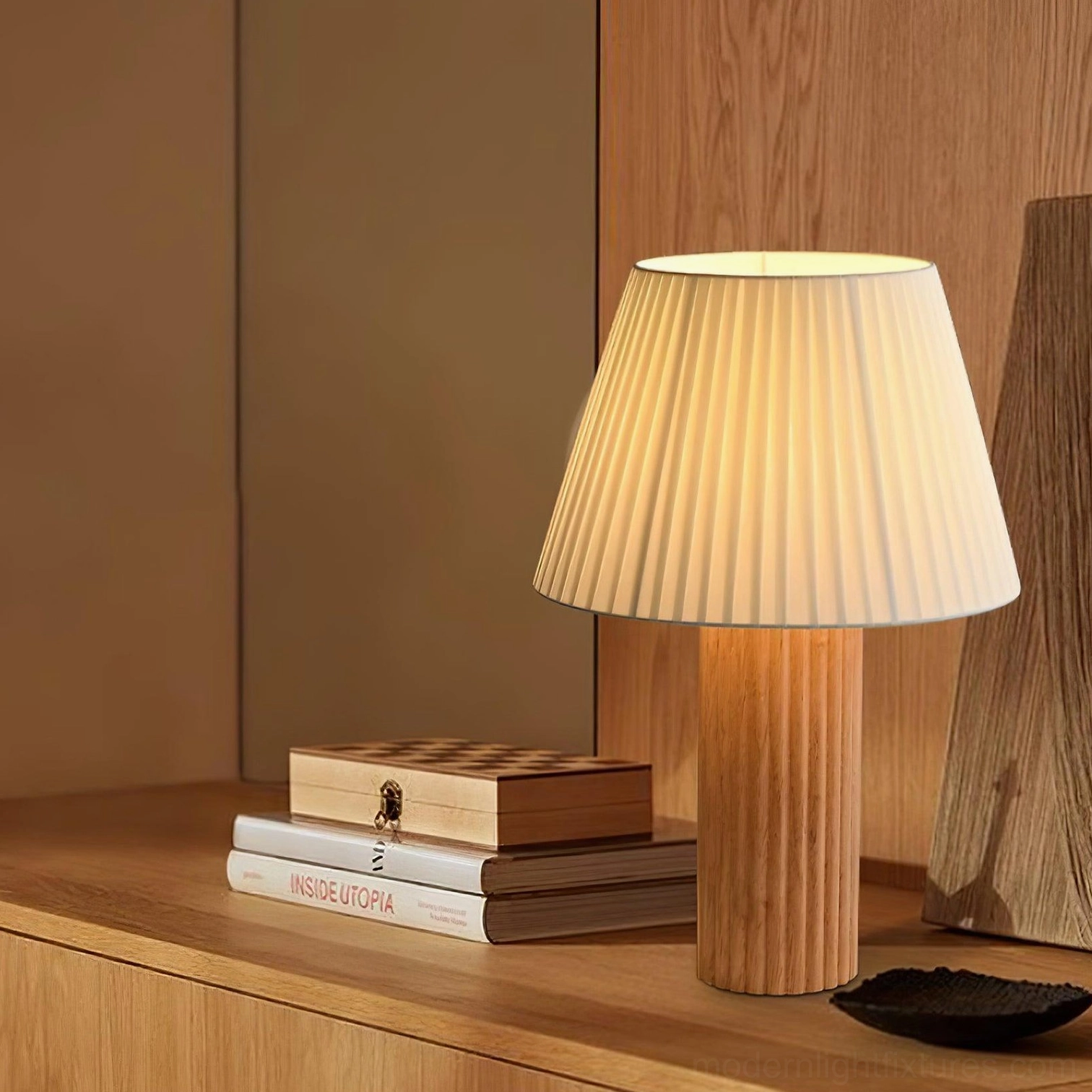 Modern minimalist table lamp with ribbed wooden base and soft pleated shade in neutral color palette complementing transitional home décor