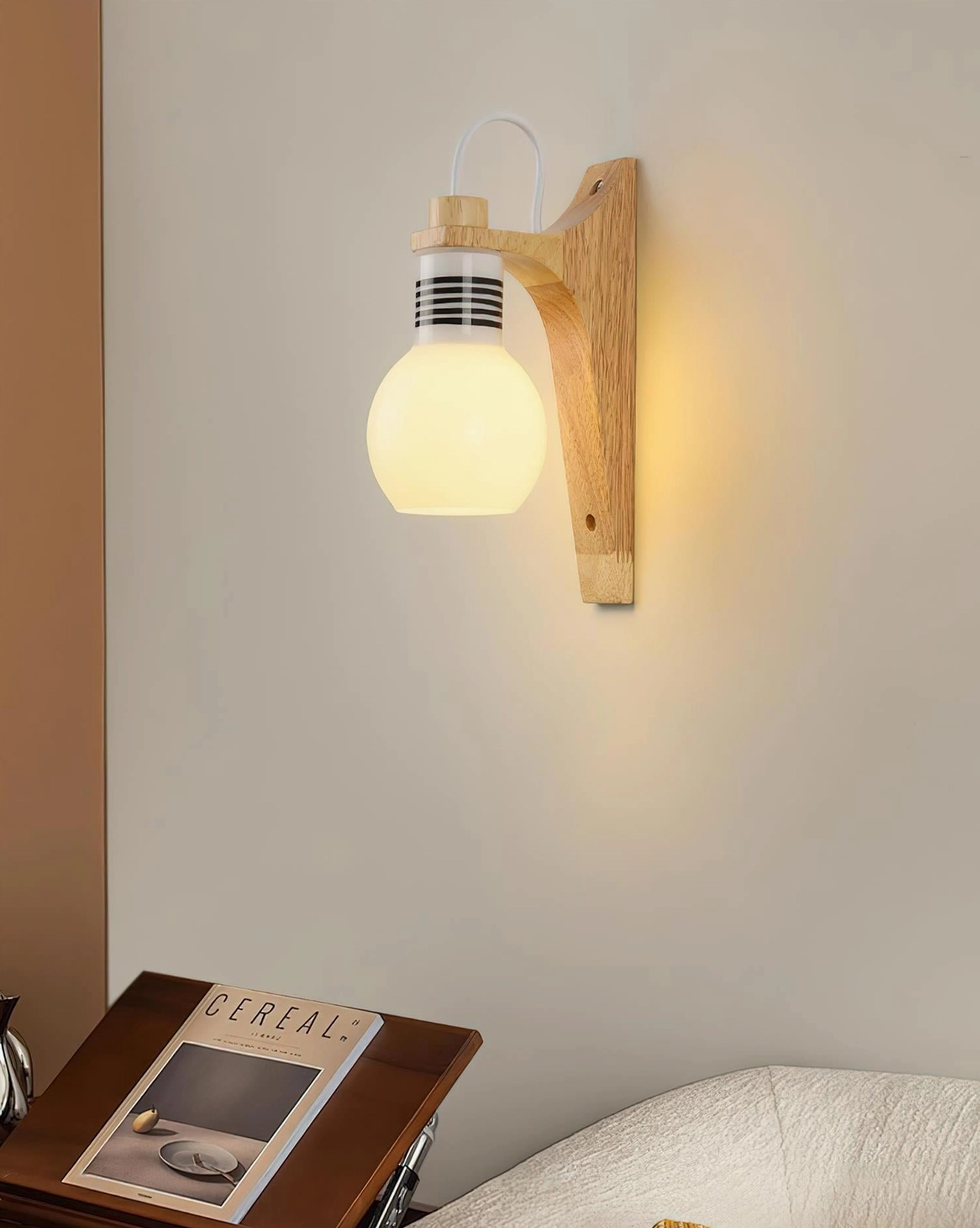 Minimalist wooden globe wall lamp in warm bedroom environment, bedside reading light application