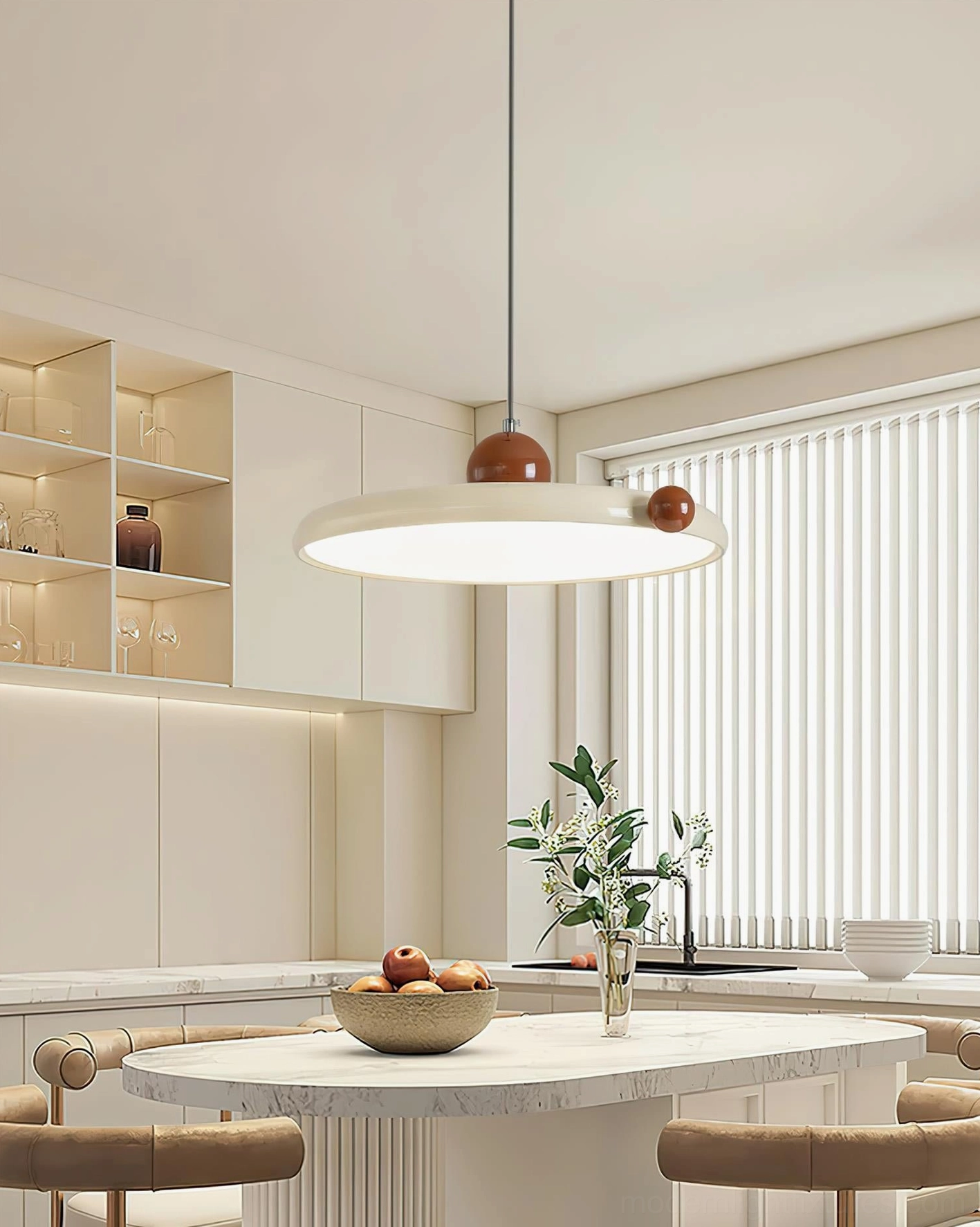 Contemporary disc pendant lamp over marble round dining table in modern kitchen area