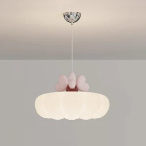 Pink heart cloud pendant light fixture hanging from ceiling, low-angle indoor view showing chrome mount and scalloped cream shade