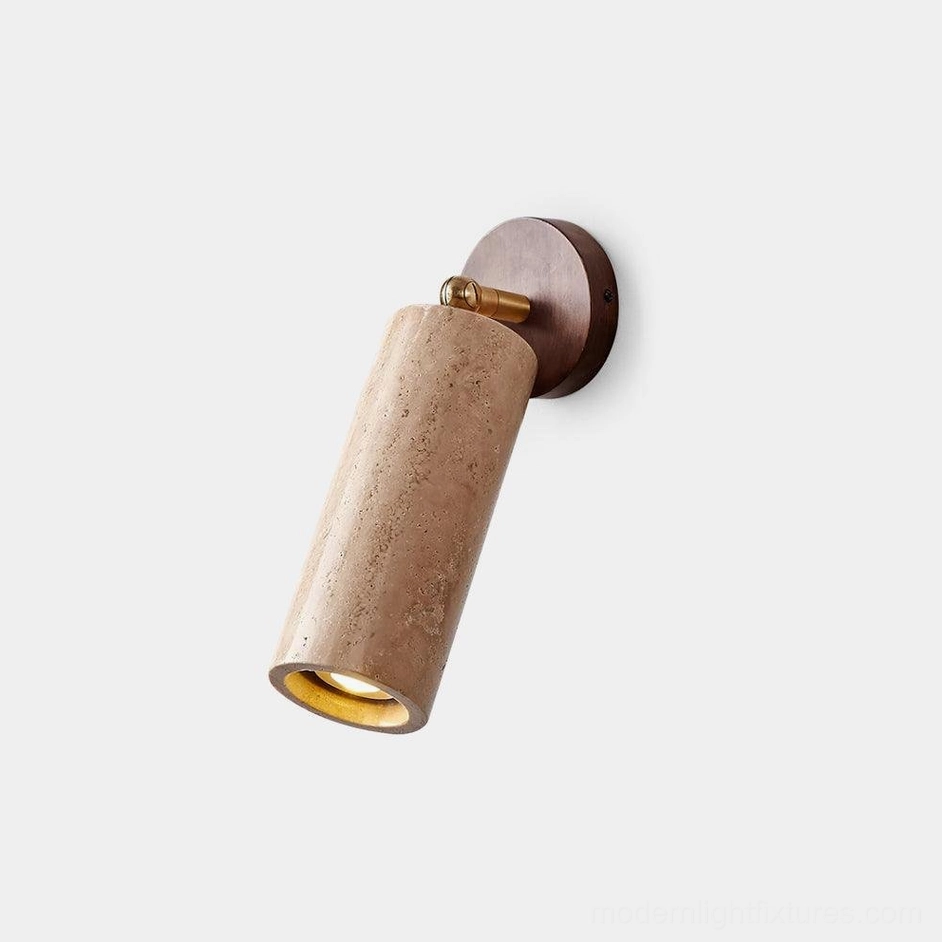 Mireille travertine wall sconce front close-up with brass swivel mount and natural stone texture detail