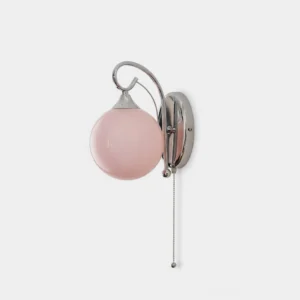 Pink glass globe wall sconce with polished chrome curved arm and pull-chain switch, front studio view