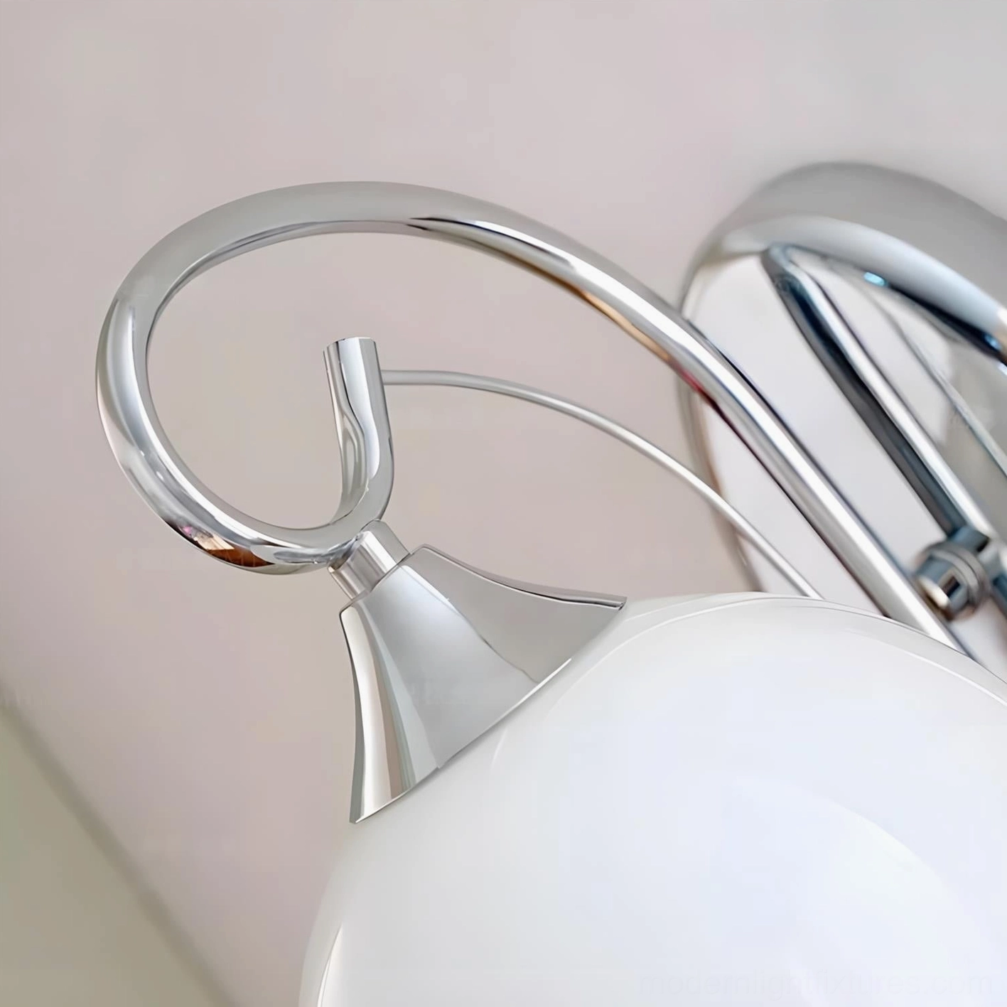Mirelle Glo wall sconce product photography, polished chrome and frosted glass globe, modern light fixture