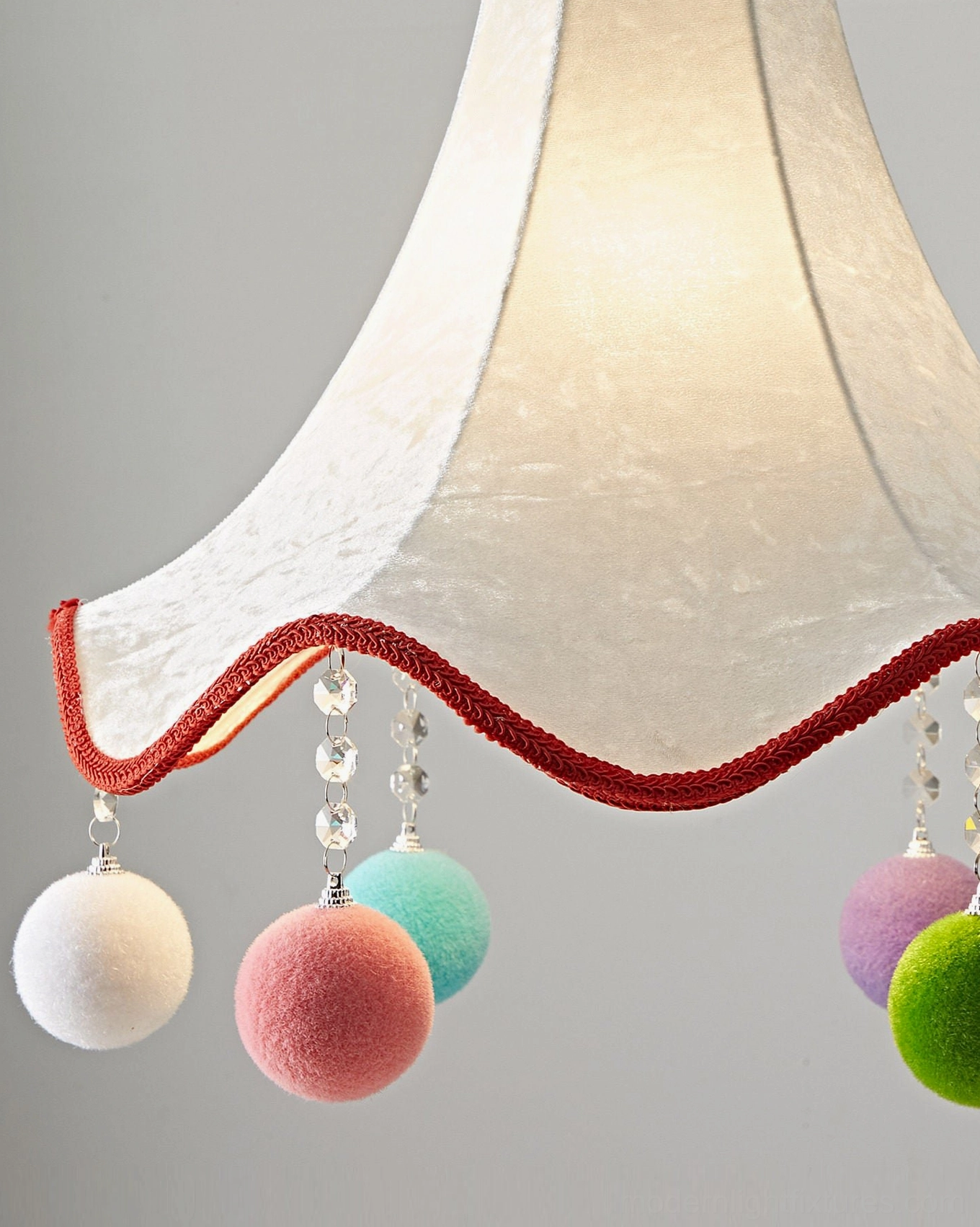 Mireo fabric pendant light with distinctive pom-pom accents and scalloped edge - architectural design perspective