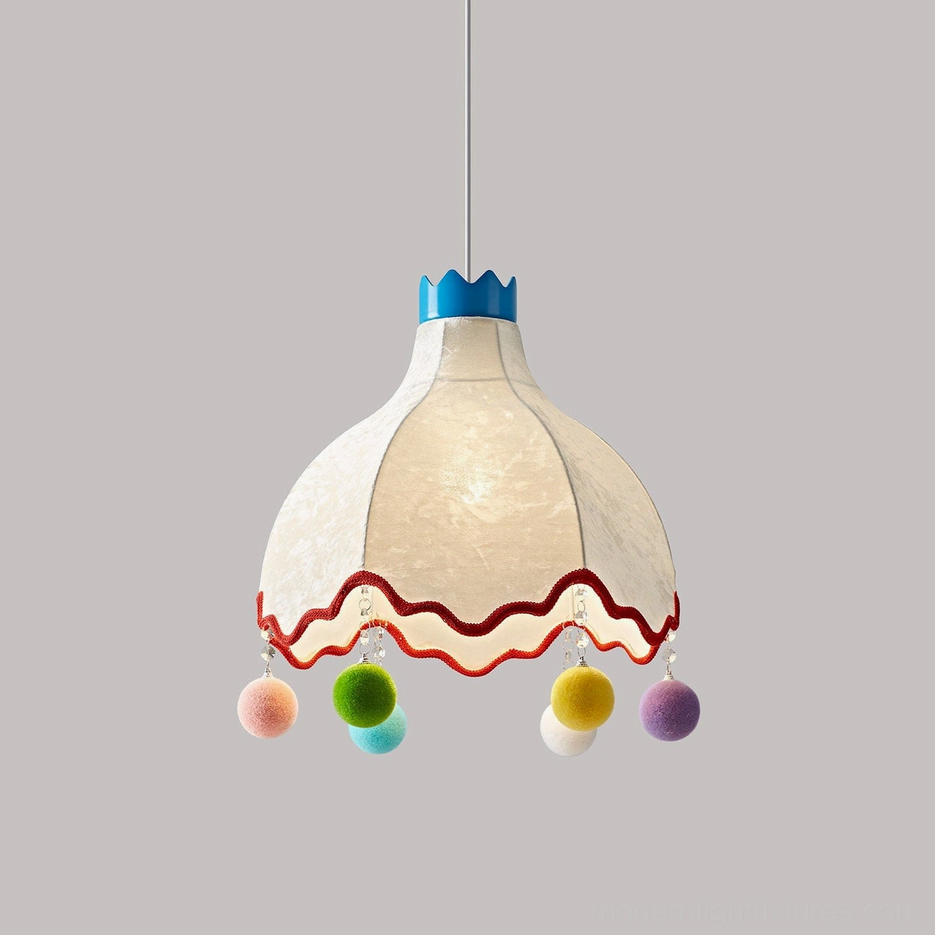 Mireo pendant lamp featuring scalloped fabric shade with blue crown top and pastel pom-pom accents - flat front studio display