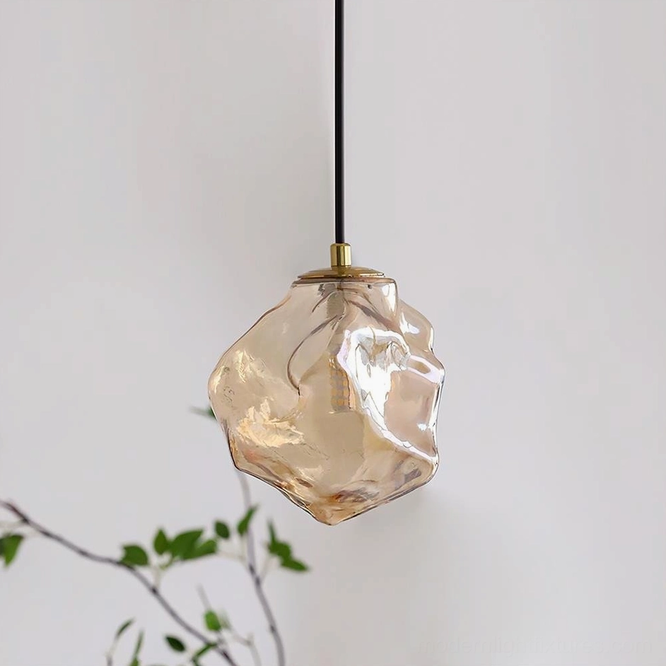 Mirza amber glass pendant lamp with warm golden tone, hand-shaped irregular form, artistic glassmaking craftsmanship