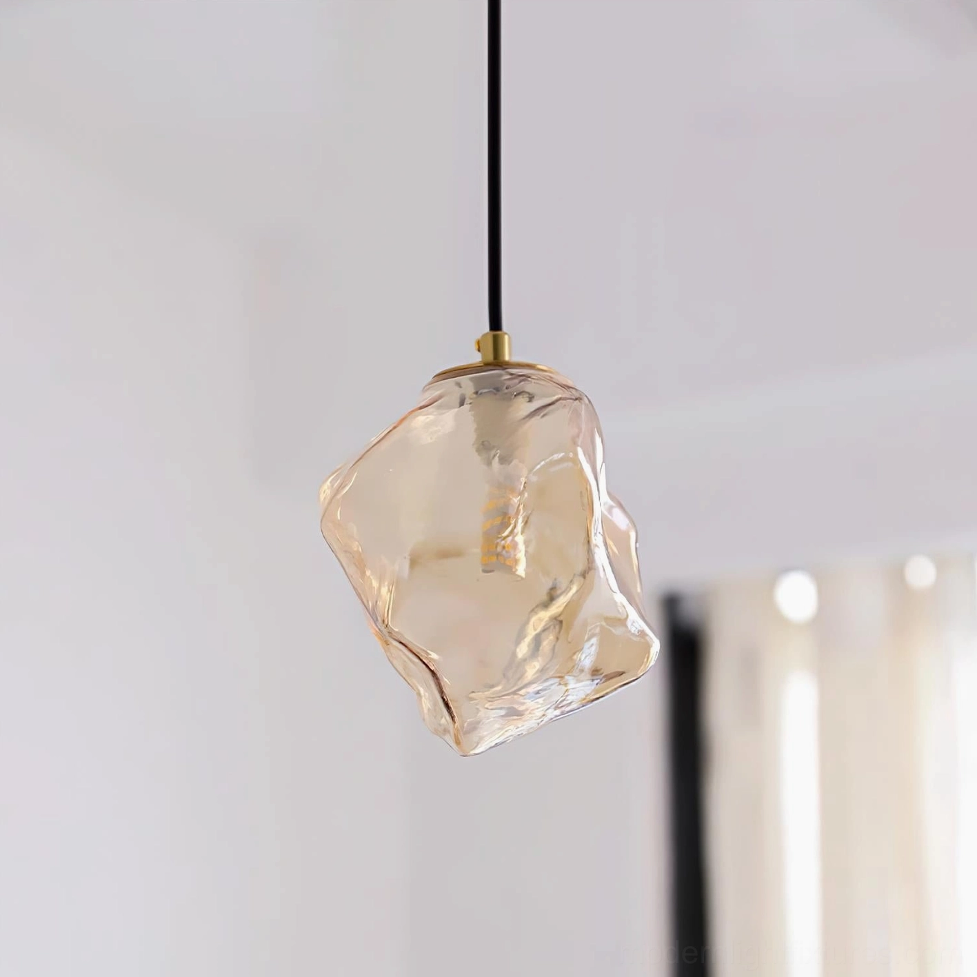 Mirza modern glass pendant light fixture detail showing brass hardware, G9 socket, and suspension cord assembly