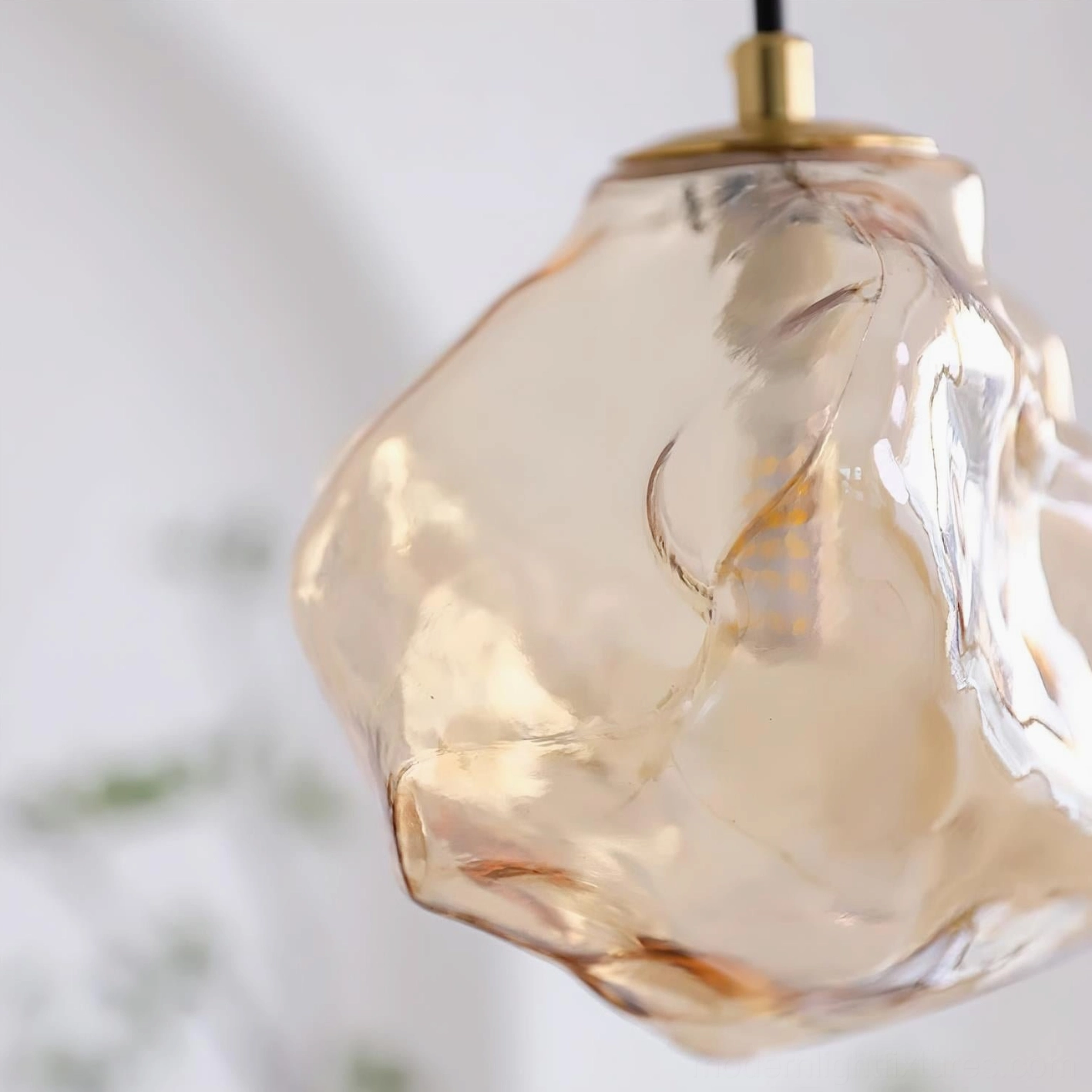 Mirza handcrafted glass pendant light styling in modern Scandinavian interior with minimalist furniture and contemporary aesthetic