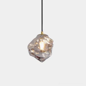 Mirza handcrafted glass pendant light with smoke gray irregular shade and brass hardware, frontal view with minimalist white background